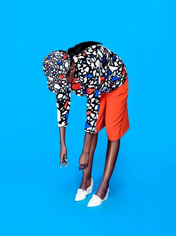 Geometric fashion figure on solid blue, photographic, bold, vibrant
