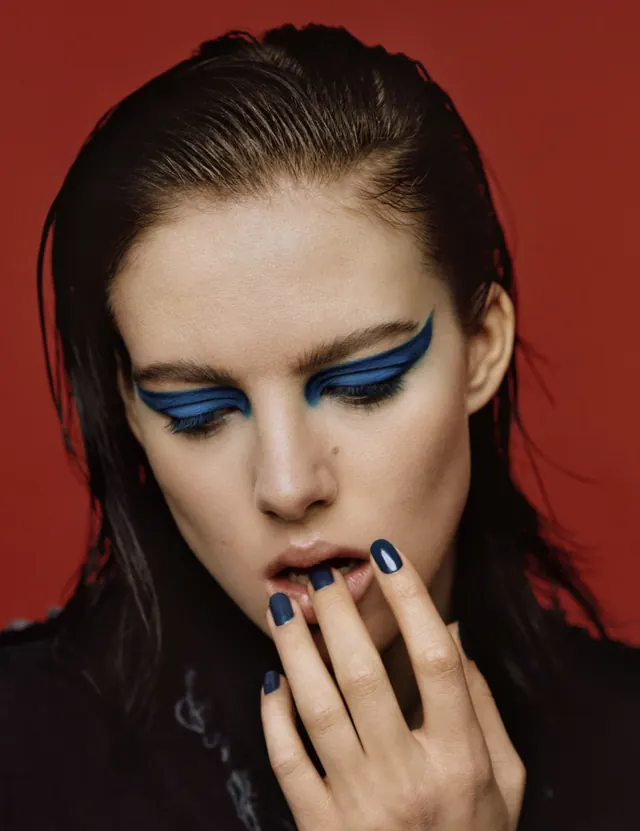 Blue winged eyeliner beauty close-up, photographic, minimal, vibrant