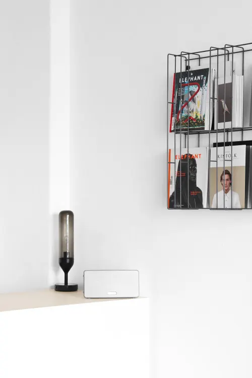 Minimalist white shelf with wire magazine rack, minimal, light-mode, light