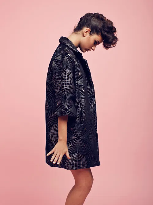 Geometric black jacket fashion portrait, minimal, editorial, light