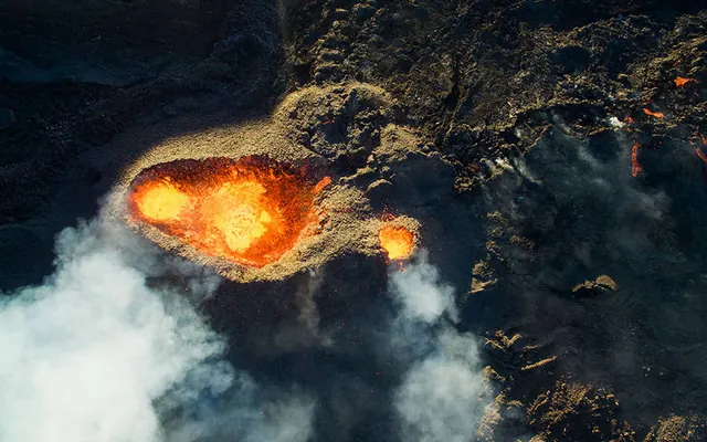 Aerial volcano lava flow photograph, photographic, dark-mode, dark
