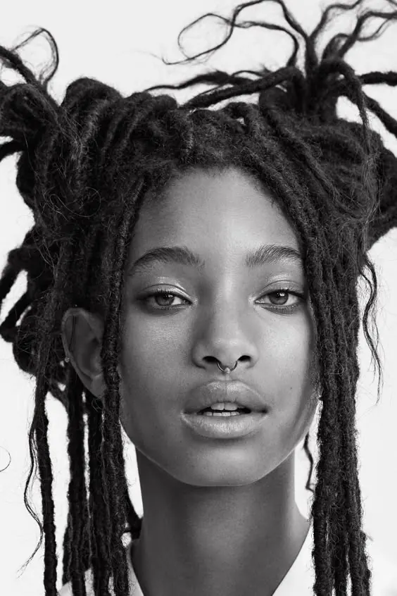 Monochrome fashion editorial portrait with sculptural hair, editorial, photographic, monochrome