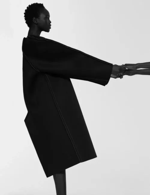 Minimalist fashion portrait in black, minimal, photographic, monochrome