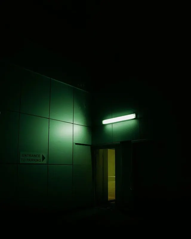 Minimalist green parking garage entrance at night, minimalist, technical, dark