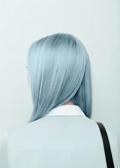 Back portrait with blue-grey asymmetric hair, photographic, minimal, cool