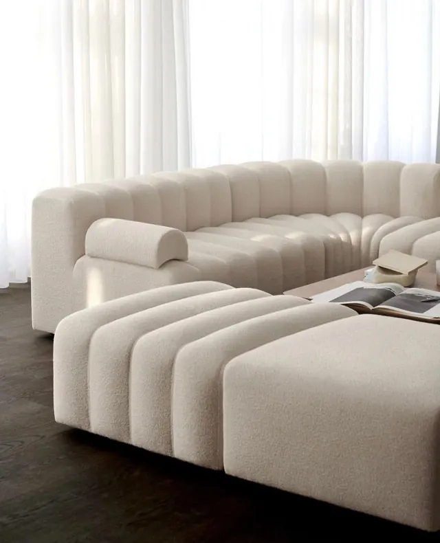 Sculptural neutral modular sofa in living room, minimalist, organic, light