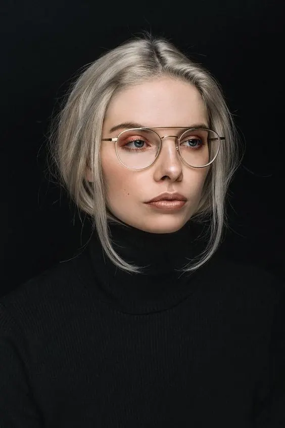 Portrait of woman with blonde hair and glasses, photographic, editorial, dark