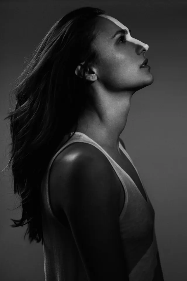 Black and white portrait profile, photographic, monochrome, dark