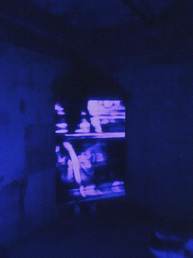 Blurry neon monitor in dark room, dark-mode, photographic, dark