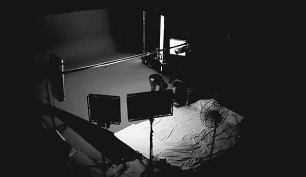 Monochrome behind-the-scenes studio photograph, photographic, monochrome, dark