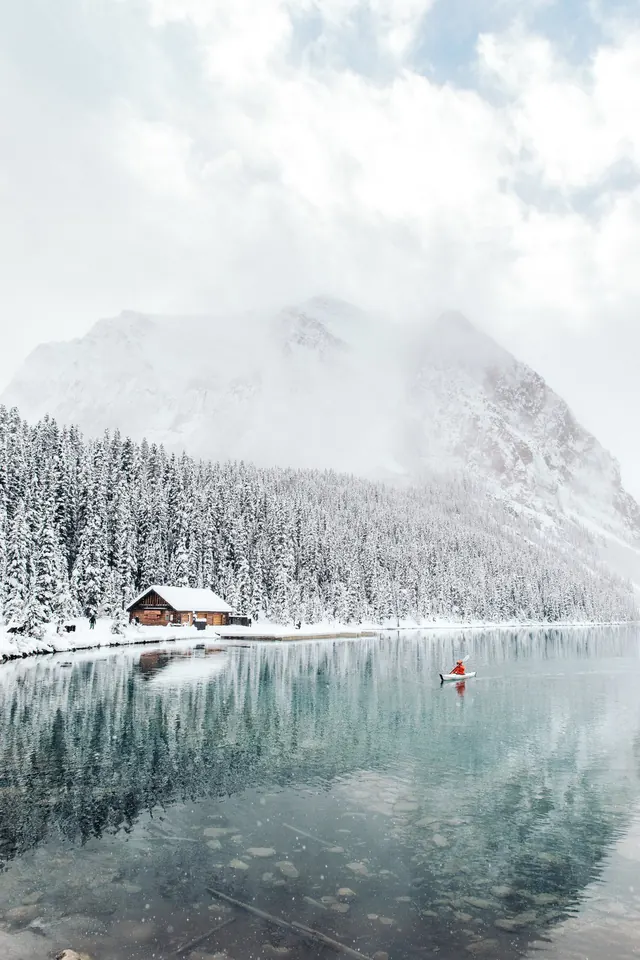 Snowy mountain lake cabin landscape, photographic, minimalist, cool