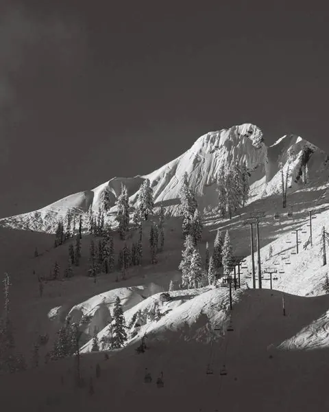 Snow-covered mountain landscape, photographic, minimal, monochrome