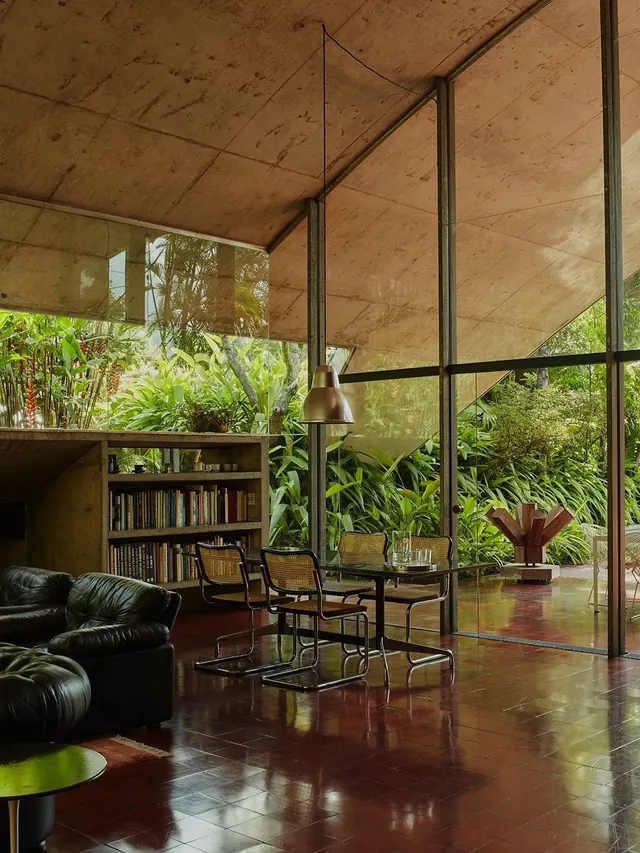 Mid-century modern interior with lush garden view, minimal, organic, earthy