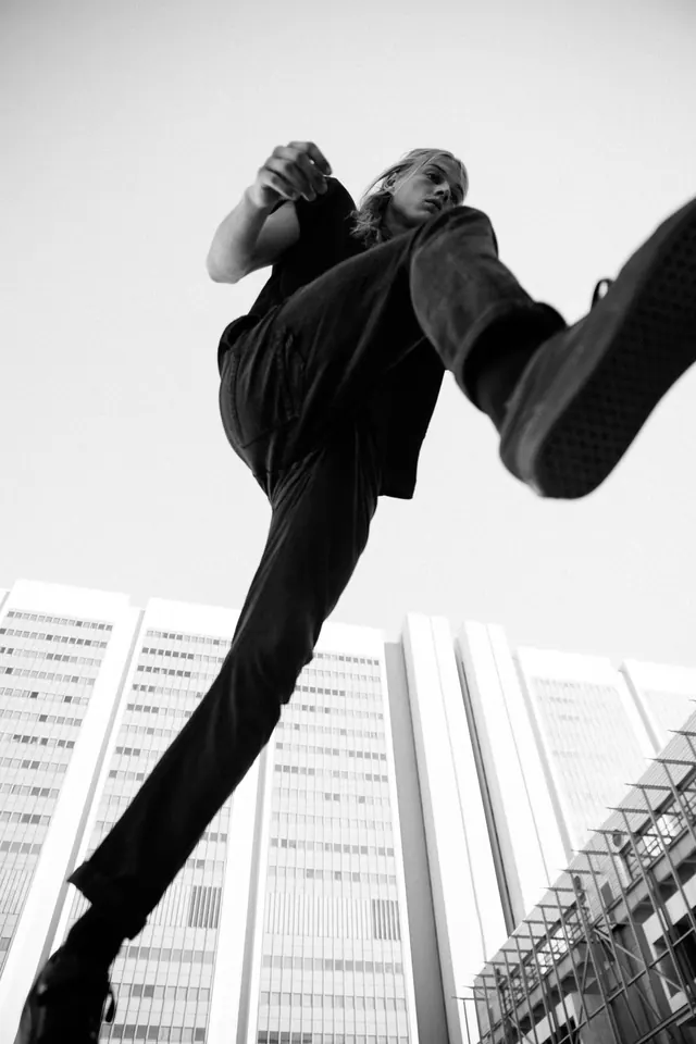 Dynamic upward leap portrait, photographic, monochrome, monochrome