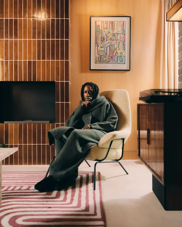 Interior portrait in mid-century room, photographic, editorial, warm
