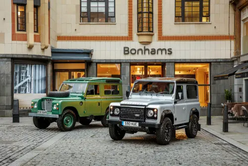Bonhams auction house storefront with vintage vehicles, photographic, editorial, warm