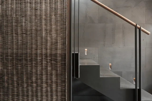 Modern architecture interior with rattan screen and concrete wall, minimal, technical, warm
