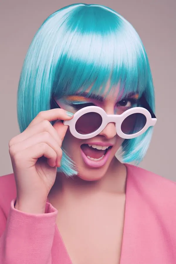 Playful editorial portrait with oversized eyewear, playful, editorial, vibrant