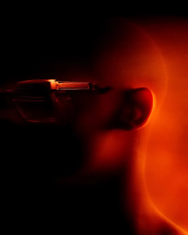 Glowing red glass laboratory flask, photographic, dramatic, dark