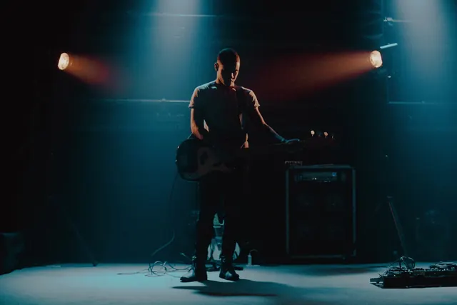 Dark stage performance with twin spotlights, photographic, dark-mode, dark