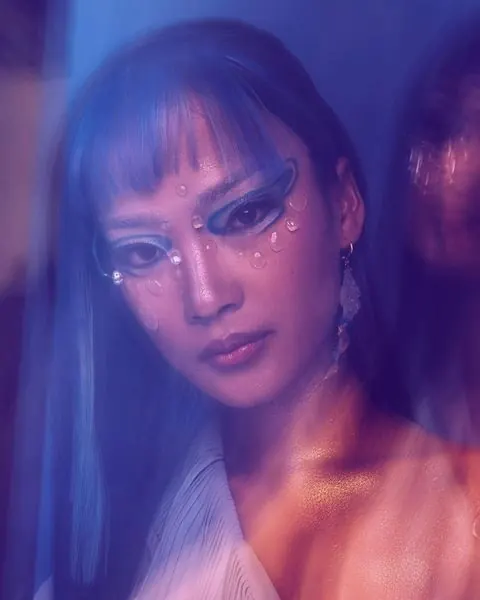 Portrait with iridescent gradient lighting and face jewelry, photographic, artistic, gradient