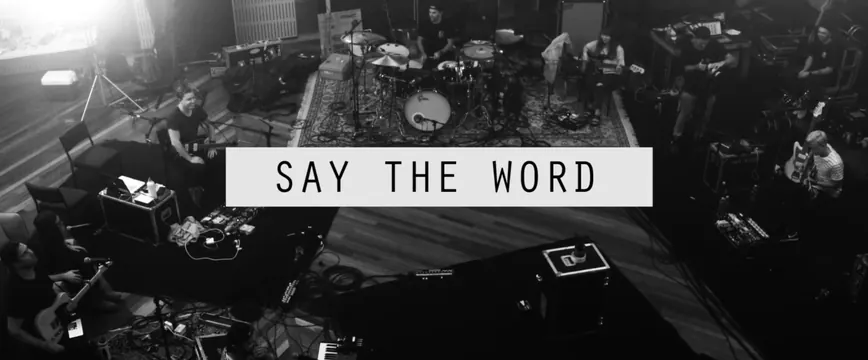 Band performance studio shoot with text overlay, photographic, editorial, monochrome