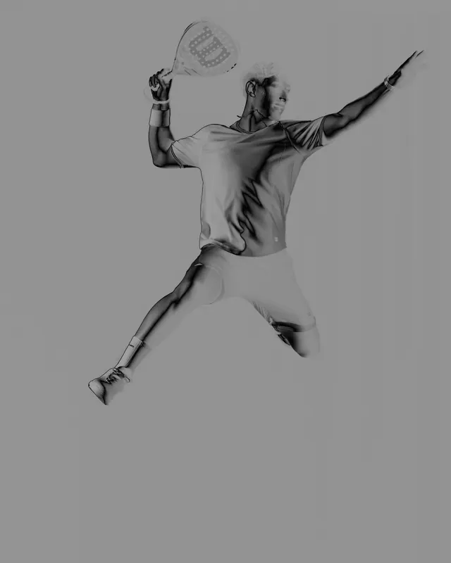 Tennis player in motion against grey background, photographic, minimal, monochrome