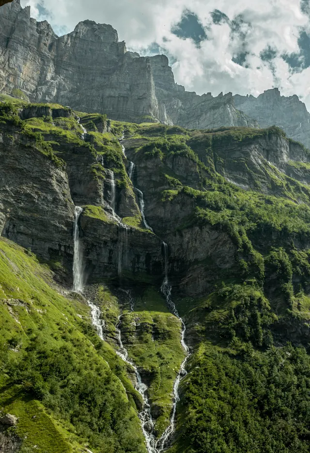 Alpine Gorge with Cascading Waterfalls, photographic, organic, cool