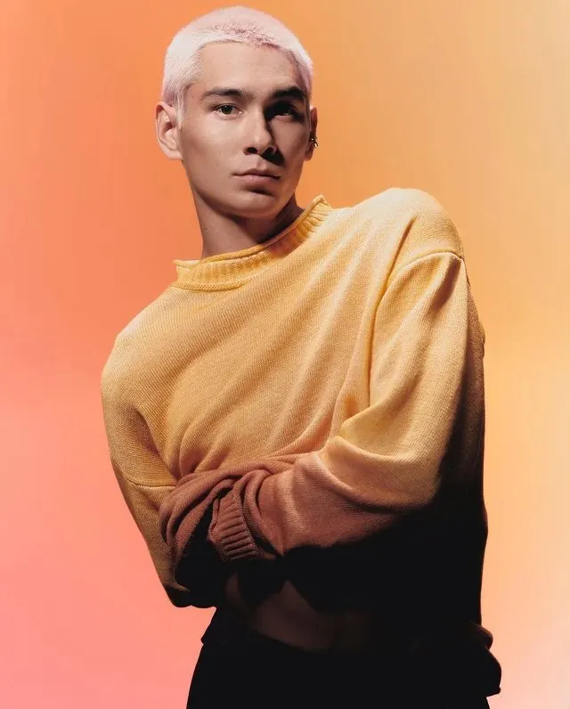 Fashion portrait with warm gradient background, photographic, minimal, warm