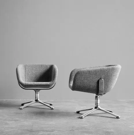 Two modern lounge chairs in light gray fabric with pedestal base, photographic, product, light