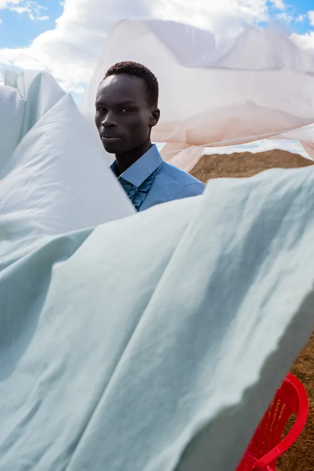 Desert editorial portrait with white fabrics, photographic, editorial, light