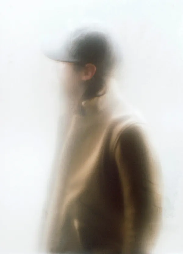 Soft focus blurred portrait with cool tones, photographic, minimal, muted