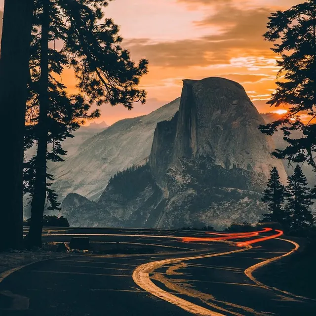Golden hour landscape with mountain vista, photographic, editorial, warm