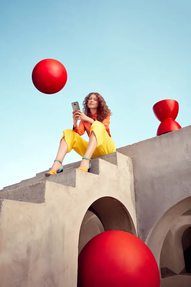 Motorola product photography with red spheres, photographic, playful, vibrant
