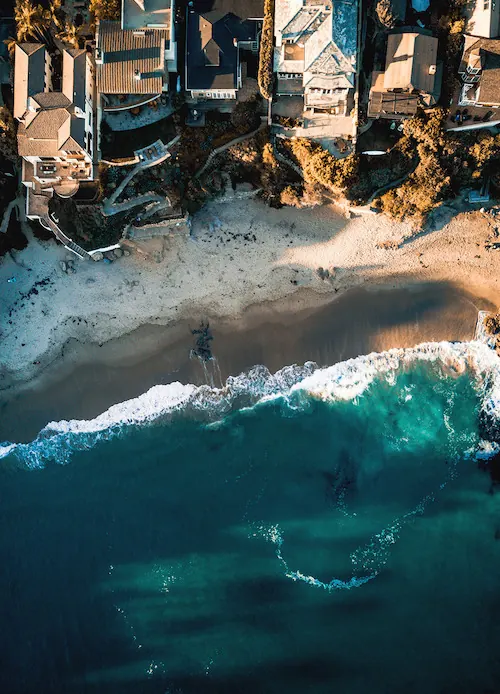 Coastal residential development aerial shot, photographic, minimal, cool