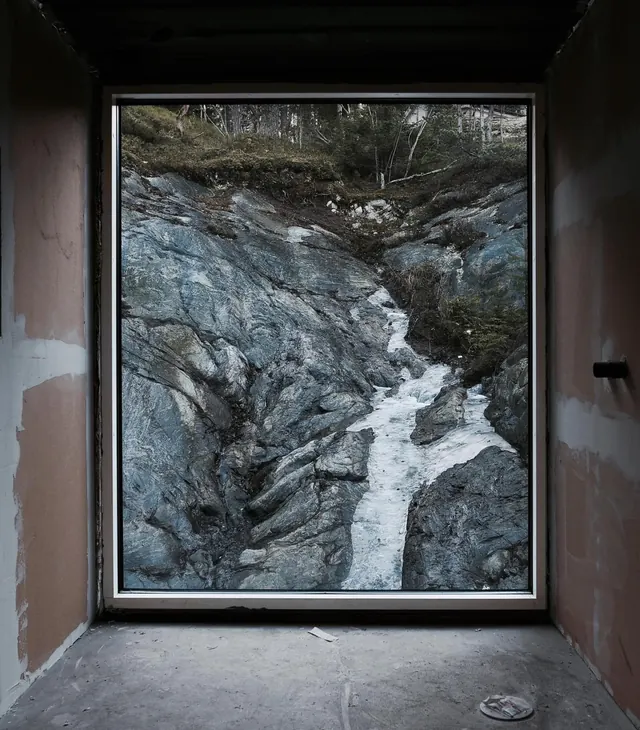 Rocky ravine aerial view from architectural frame, photographic, minimal, cool
