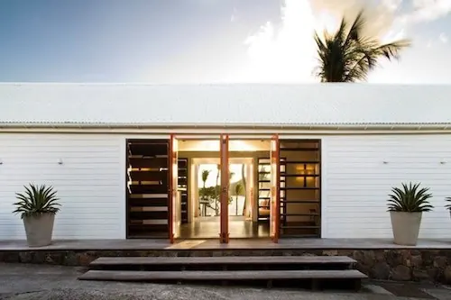 Modern building facade with centered entrance, minimal, corporate-clean, light