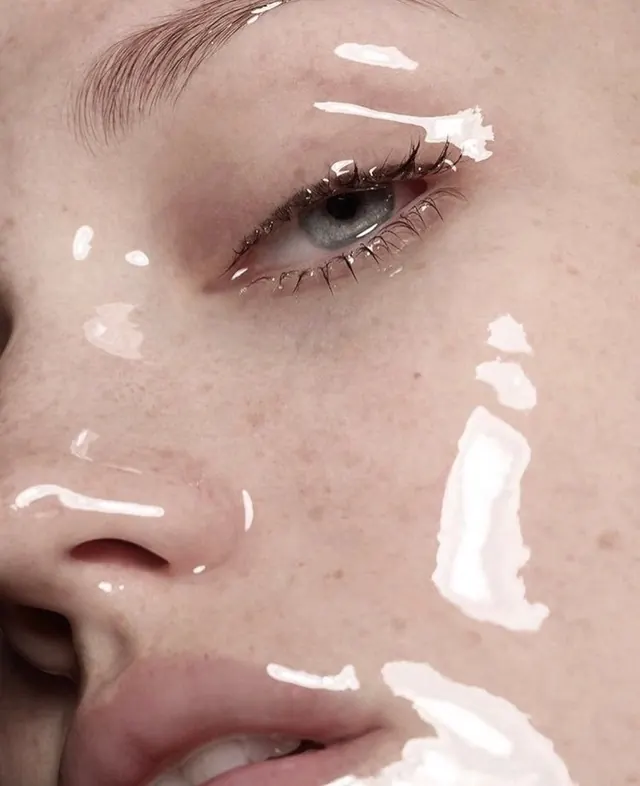 Beauty makeup close-up with white accents, photographic, minimalist, warm