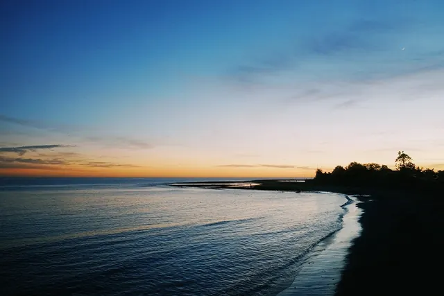 Coastal sunset over Malibu beach, photographic, cool