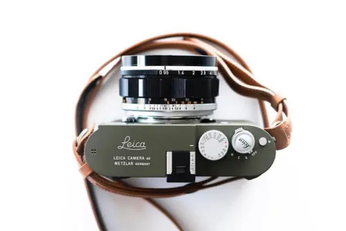 Vintage Leica camera flat lay, photographic, minimal, muted