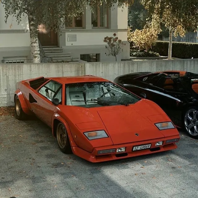 Red sports car in residential driveway, photographic, warm, warm