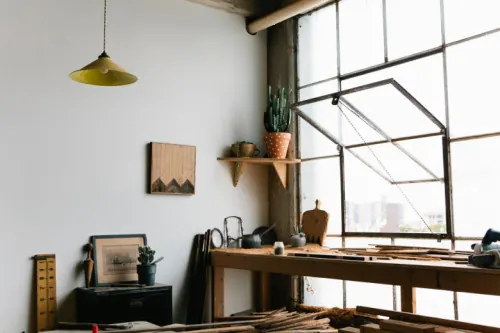 Industrial workspace with brass pendant, minimalist, organic, light