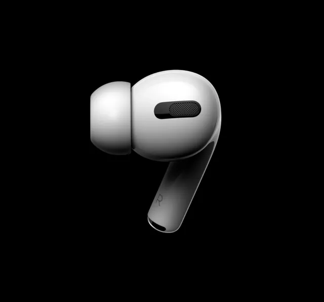 Apple AirPods Pro in white against black background, photographic, minimal, monochrome