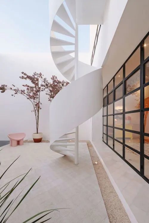 Spiral staircase in minimalist interior, photographic, minimal, light
