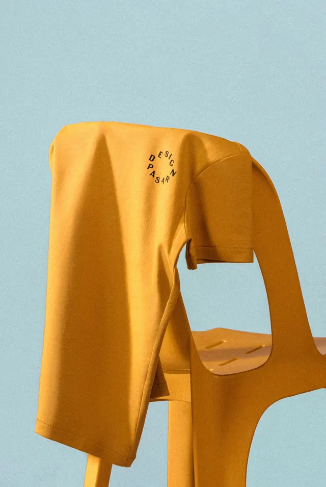 Oversized yellow garment on figure, photographic, playful, warm
