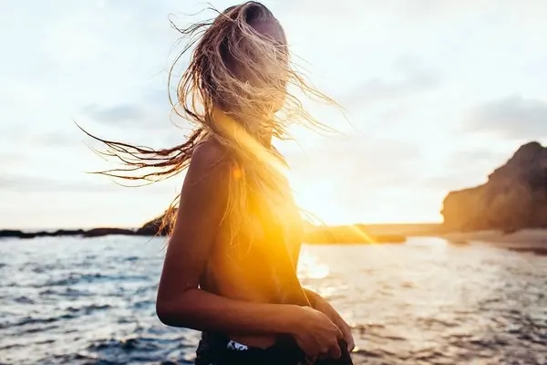Sunset beach portrait with golden light, photographic, warm, warm