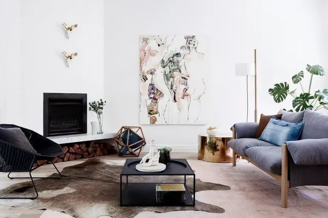 Modern living room with mixed materials and wall art, corporate-clean, minimal, dark