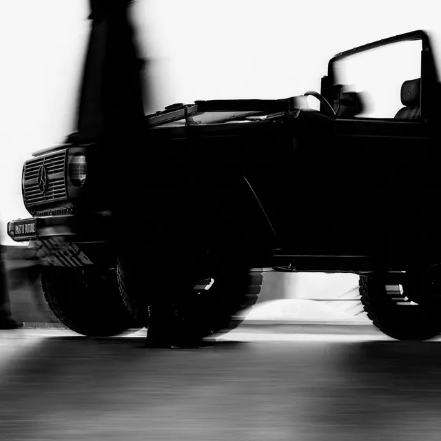 Vintage convertible car silhouette, monochrome, photographic, dark