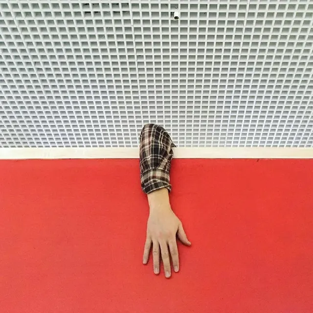 Hand on colored surface texture study, photographic, minimal, vibrant