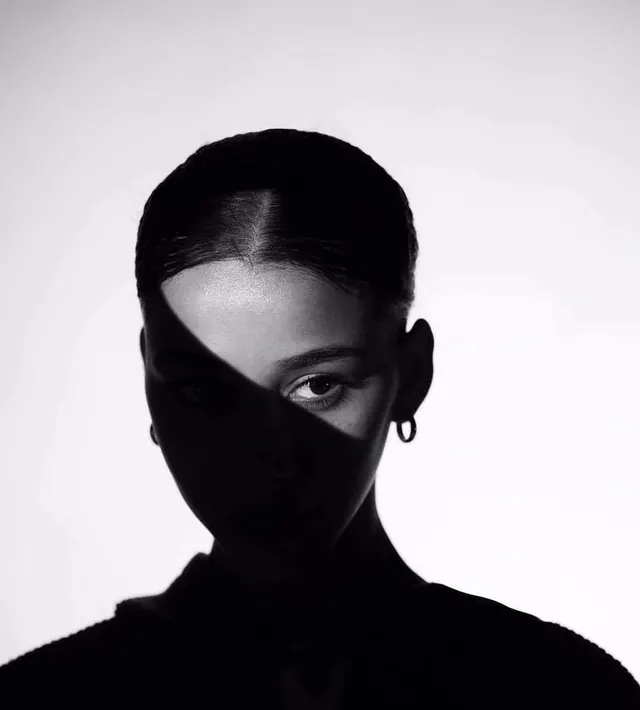 High-contrast portrait silhouette, minimal, monochrome, dark